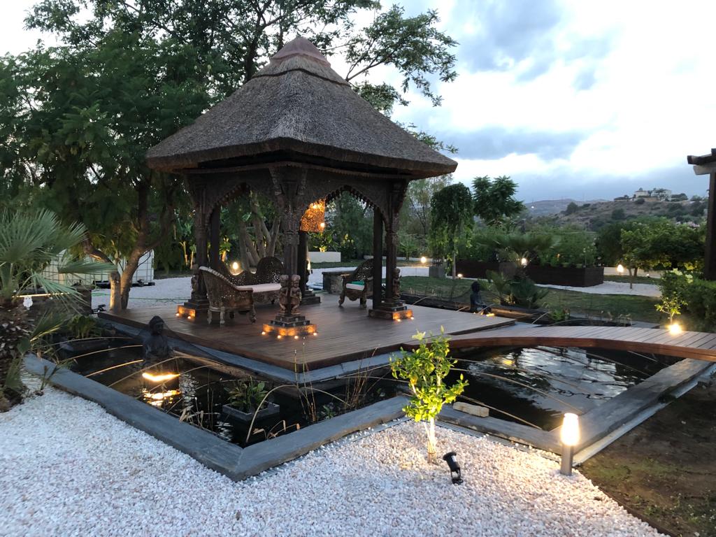 A beautiful Mediterranean villa with a lush, well-maintained garden, showcasing the high-quality gardening services provided by Cobalt Garden.